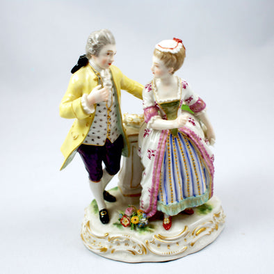 A Meissen group the letter